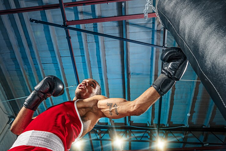 How to hit punching bag with boxing gloves on